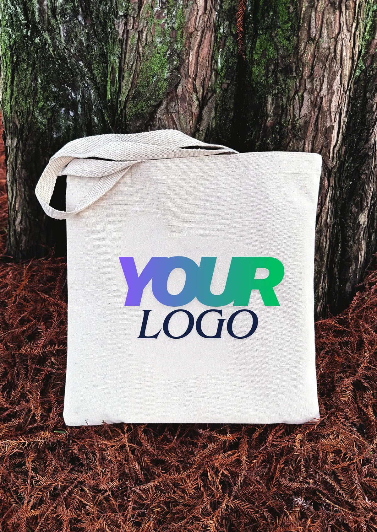 White tote bag with 'YOUR LOGO' text against a natural background